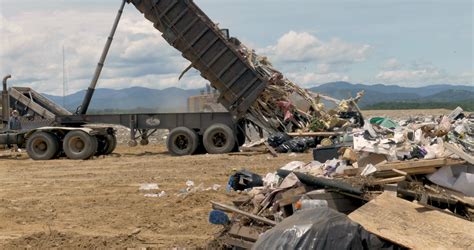 large dump truck emptying dumpster  stock footage sbv