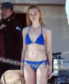 Elle Fanning Shows Toned Torso In Blue Bikini While Filming Galveston