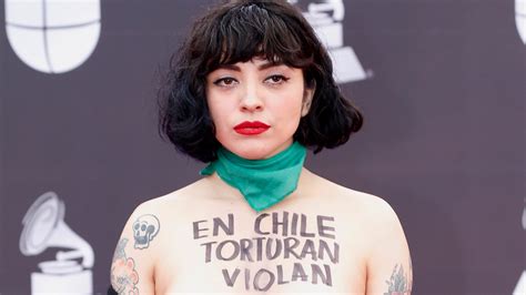 latin grammys mon laferte exposes bare chest  political protest