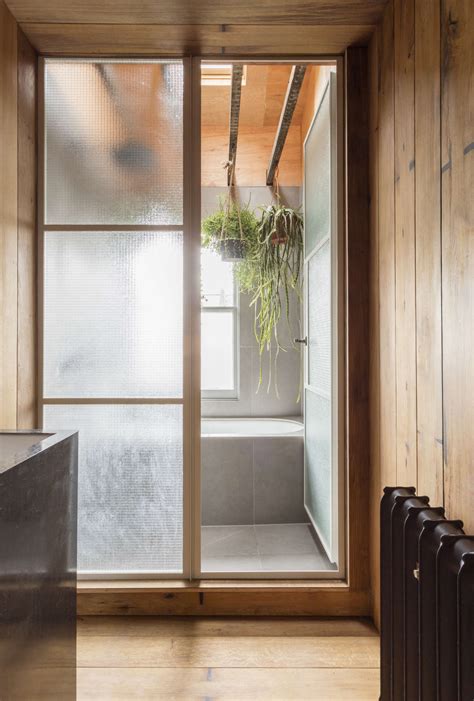 a japanese style two room bath filled with hanging plants