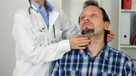 female doctor examine patient for sore throat hd stock