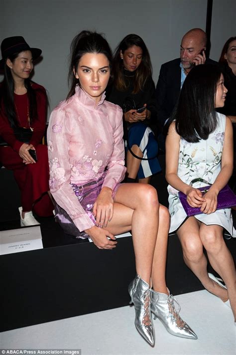 braless kendall jenner flashes her cleavage in sheer pink blouse at pfw