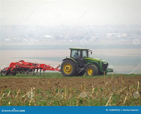 tractor plowing   field editorial photography image  machinery country