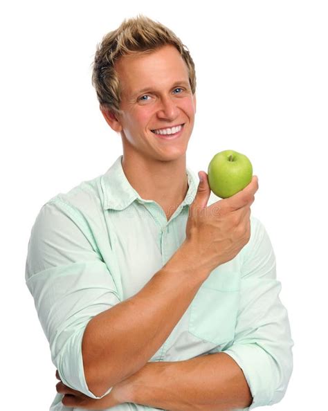 handsome young man holding  apple stock photo image  shirt organic