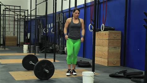 girl doing a snatch olympic lift side view stock footage video