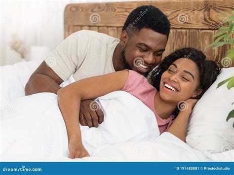 Happy Romantic Black Couple Cuddling In Bed Stock Image Image Of