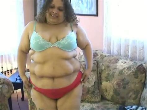 bbw latina milf with saggy tits and huge belly poses for the camera