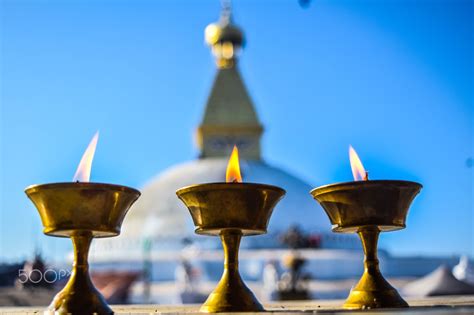 butter lamps and the boudhanath stupa butter lamps lit up in boudhanath stupa located in