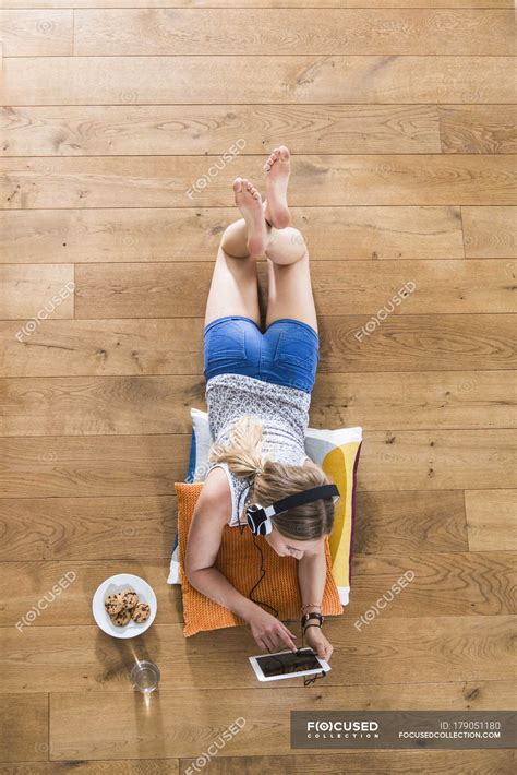 Tween Girl Lying Barefoot Stock