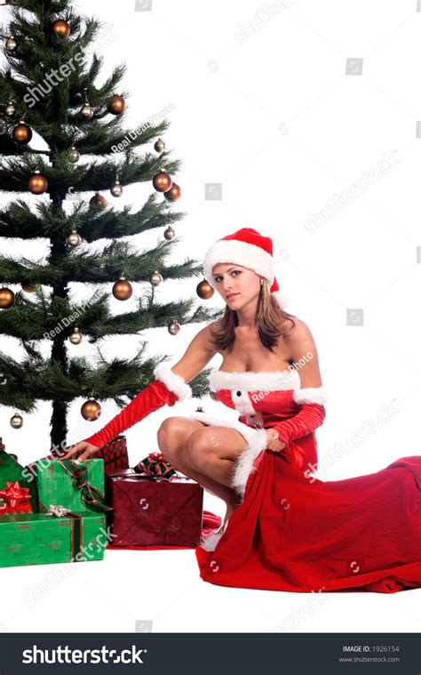 sexy ms santa claus unloading christmas ts from santa s bag and