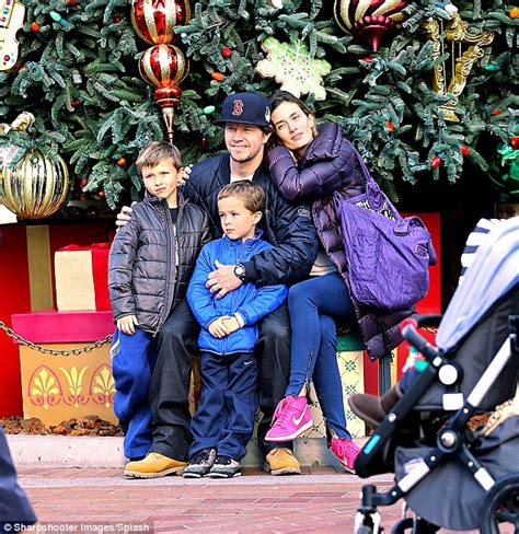 mark wahlberg spreads holiday cheer    family pose  christmas tree  disneyland