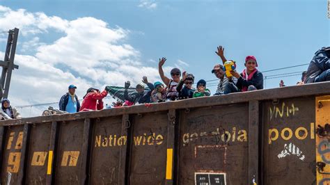 caravan of migrants climbs freight train for the next leg of the