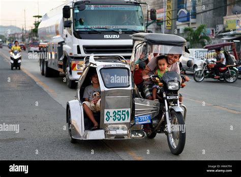 philippines province  nueva ecija bambang tricycle motorcycle taxi  main street stock