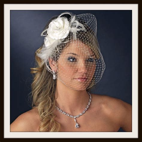 beautiful feather fascinator and bird cage face veil comb 755 white or