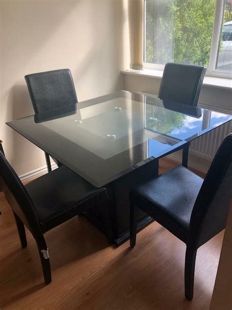 Black Glass Square Dining Table 4 Leather Effect Chairs In St Helens