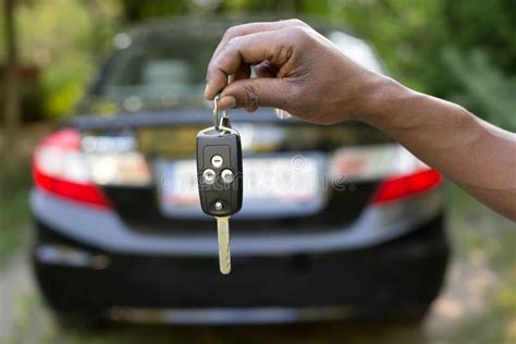 man holding car keys stock photo image  transportation