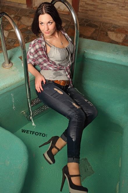 wetlook by cute girl in soaking wet shirt tight jeans and shoes in jacuzzi wetlook one