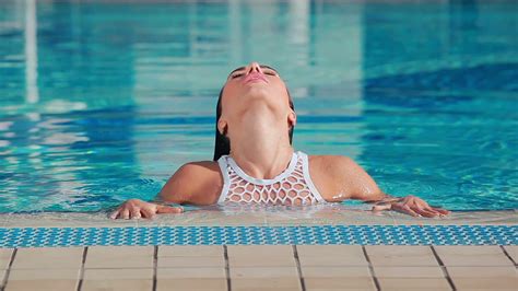 stunning woman enjoying swim in pool stock footage sbv 313524790