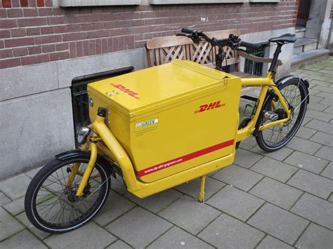 bike  dhl delivery transport daily life netherlands transportation bike delivery yellow