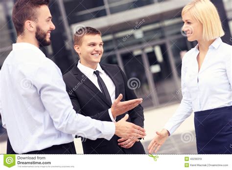 business people greeting  modern building stock image image