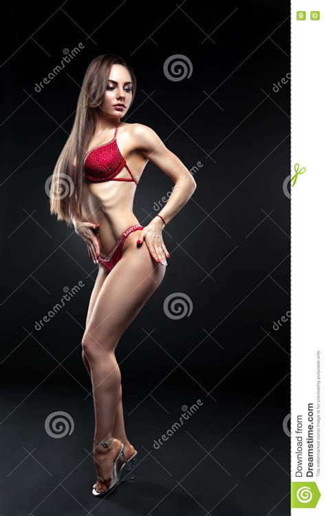 Beautiful Curvaceous Brunette Woman Posing In A Red Bikini Stock Image