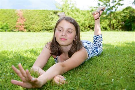 Beautiful Pre Teenage Girl Laying In Grass Stock Image Image Of