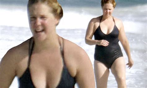 Amy Schumer Makes A Splash In Stylish Black Swimsuit On Beach Break In