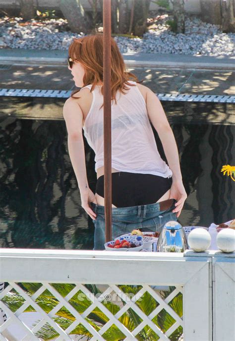 emma stone wearing a bikini at a pool in brazil where celebrity are exposed