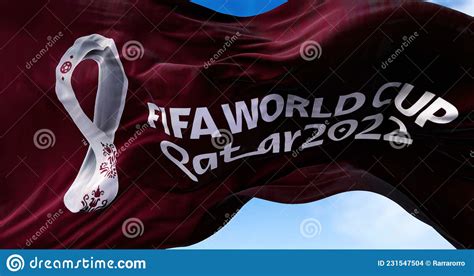 a flag with the 2022 fifa world cup logo flapping in the wind editorial