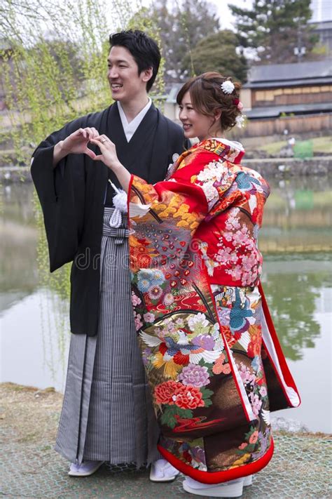 Japanese Couple In Traditional Wedding Dresses Editorial