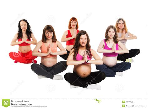 group of six smiling pregnant women doing yoga stock