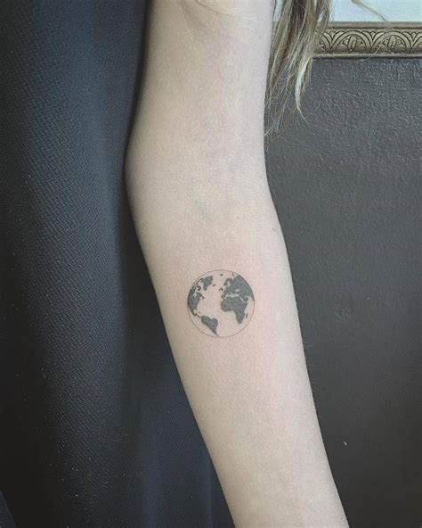 little tattoos — fine line planet earth tattoo on the left