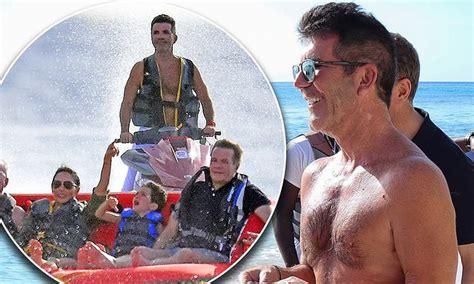 simon cowell 60 shows off his very slim figure with lauren silverman