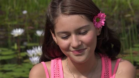 laughing teenage girl in flower garden stock footage video 14645635 shutterstock