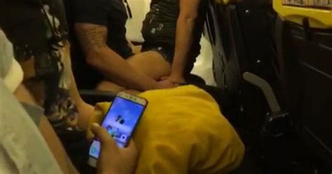 stunned ryanair passengers stare open mouthed as couple