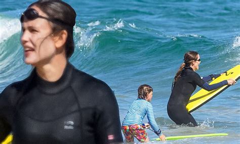jennifer garner splashes in the malibu surf wearing a wetsuit during