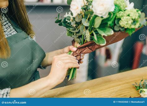 female florist decorate fresh flower composition stock photo image
