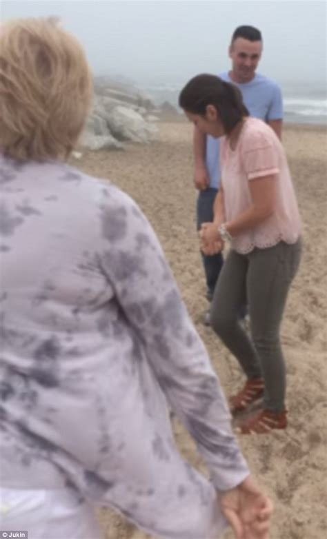 michigan woman steals the show during daughter s proposal by falling over daily mail online