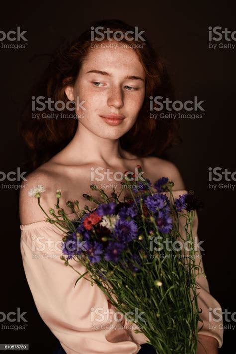 Elegant Tender Redhead Girl Holding Bouquet Of Wild Flowers Isolated On