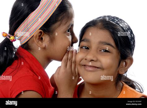 South Asian Indian Two Sisters Joking Sharing Secret In Ear Mr 152 364