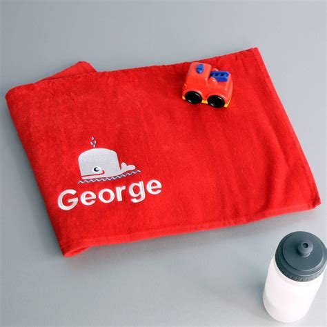 personalised red swimming towel  duncan stewart notonthehighstreetcom