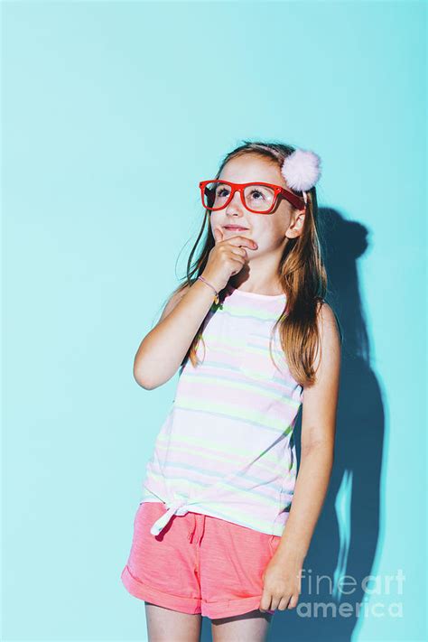 Little Pensive Girl In Red Glasses Rubbing Her Chin Photograph By
