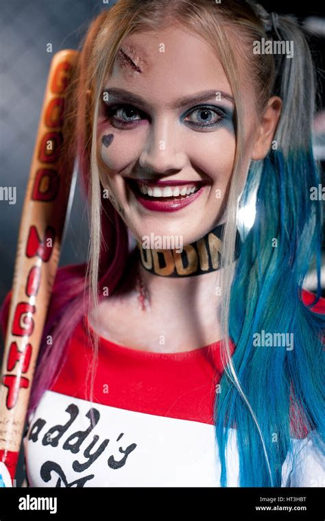 Portrait Of Smiling Girl In Costume Harley Quinn With Crazy Eyes She