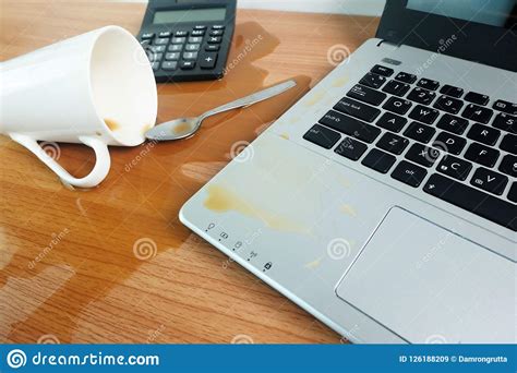 coffee cup spill   keyboard laptop computer