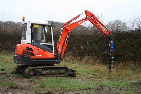 cm auger excavator powered miles hire