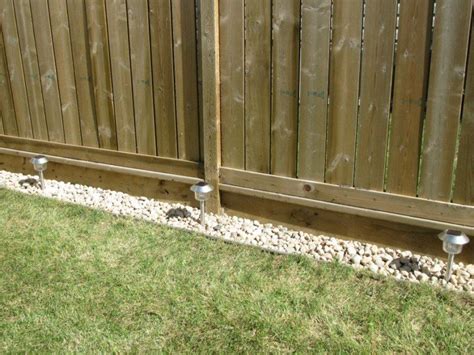 kelly loves stuff rock border   fence landscaping
