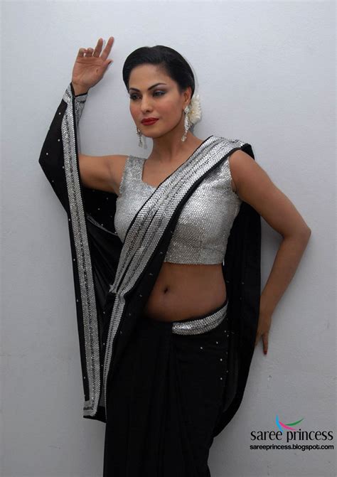 hottest paki actress veena malik looking irresistibly sexy in a black navel revealing saree pics