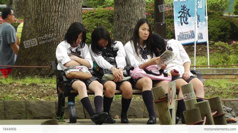 japanese schoolgirls relaxing in park in yokohama japan 11 stock video