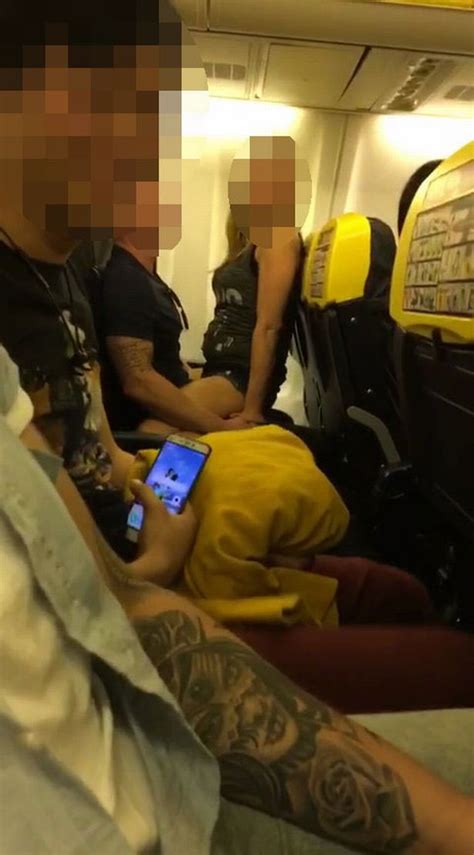 stunned ryanair passengers stare open mouthed as couple romp in front of everyone on manchester