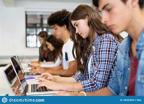 group  high school students  laptop  classroom stock image